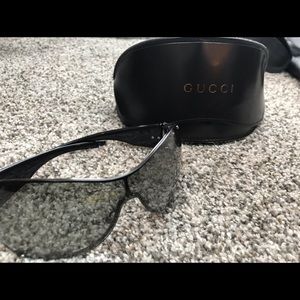Black Gucci sunglasses.